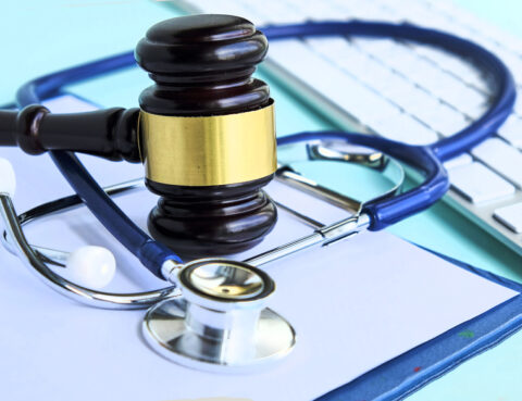 Personal Injury Lawyer Gavel and stethoscope. medical jurisprudence. legal definition of medical malpractice. attorney. common errors doctors, nurses and hospitals make