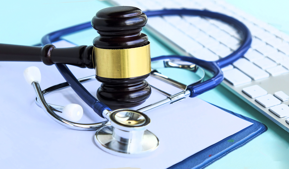Personal Injury Lawyer Gavel and stethoscope. medical jurisprudence. legal definition of medical malpractice. attorney. common errors doctors, nurses and hospitals make