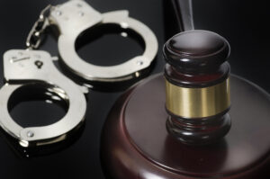 Criminal Offenses Attorney MD - Handcuffs and gavel on desk