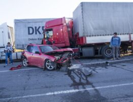 Car crushed by trucks